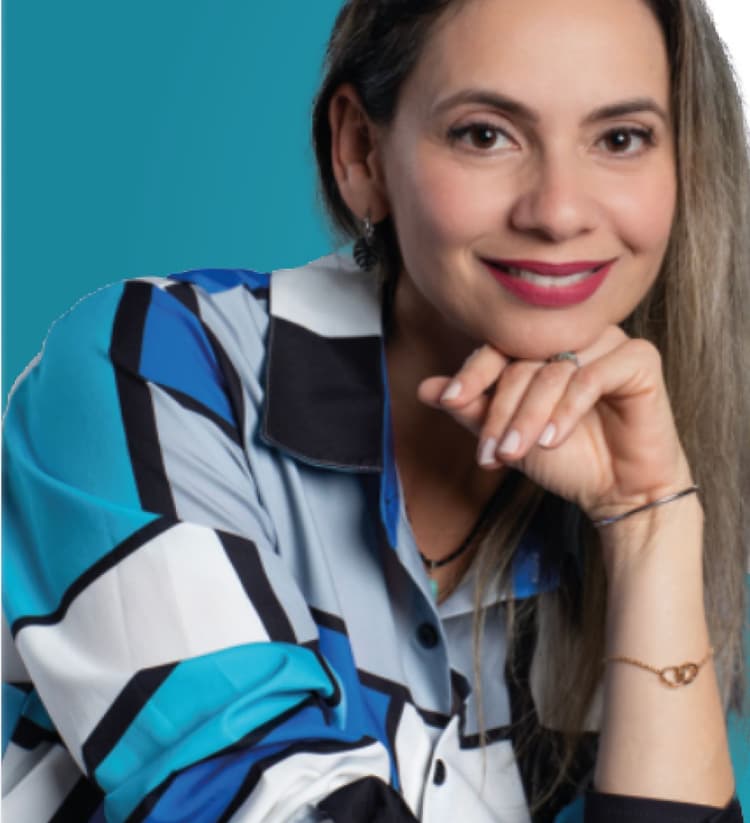 Lorena Cabal smiling, resting her chin on her hand